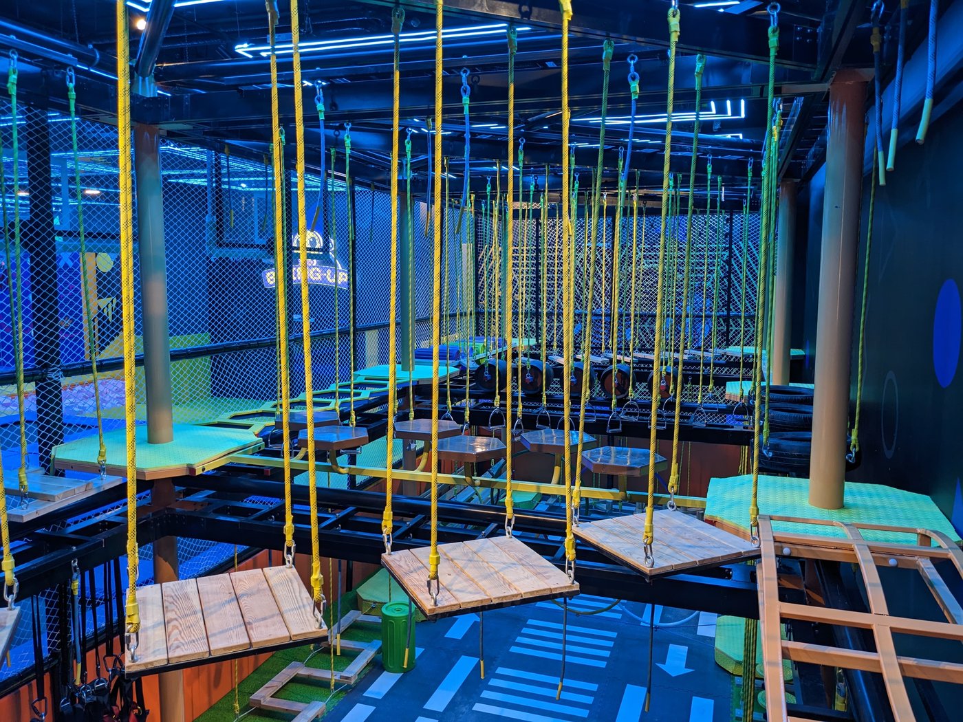 The built rope course, with orange netting and overhead rigging